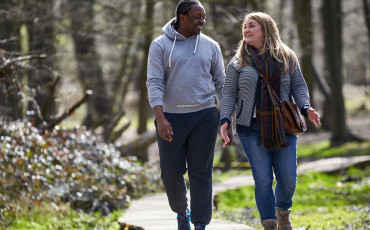 Couple walking in the woods