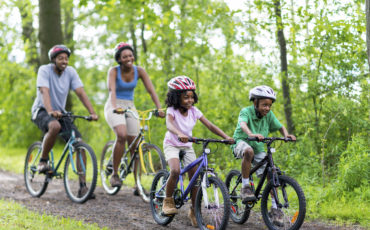 Family Riding Bikes through Physical Fitness