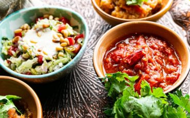Bowls with tasty vegetable salad and meat stew