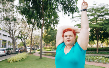 Photo of a young woman stretching