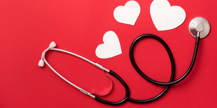 Stethoscope with white hearts to represent National Heart Month