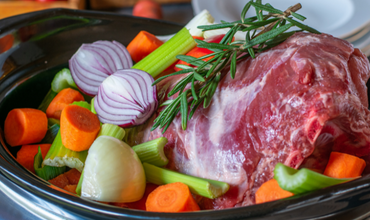 Image representing healthy slow cooker recipes with beef and veggies prepped together in a crock pot