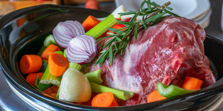 Image representing healthy slow cooker recipes with beef and veggies prepped together in a crock pot