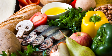 mediterranean diet meal plan with fish, fruit, olive oil and peppers