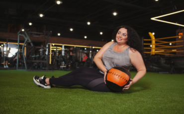 Woman using a medicine ball to workout with.