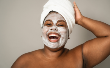 A woman having on a face mask as a form of self care.