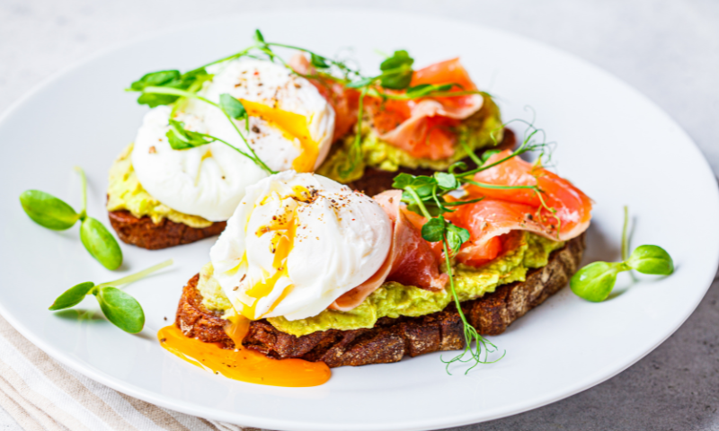Salmon with avocado and egg on toast