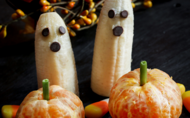 Banana ghosts with chocolate chip eyes and mouth