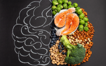 Illustration of the brain, with the right side made of healthy foods symbolizing brain health