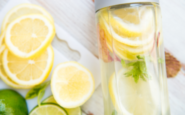Clear glass with lemon water, which is commonly used to self-detox