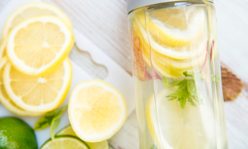 Clear glass with lemon water, which is commonly used to self-detox