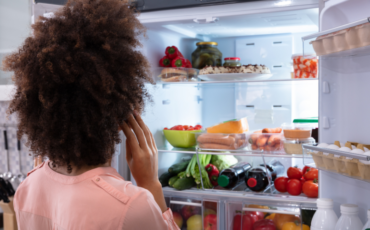 Woman in front of refrigerator