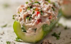 Image of a cucumber boat with tuna salad inside.